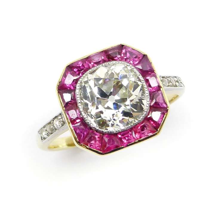 Early 20th century single stone cushion cut diamond and ruby cluster ring